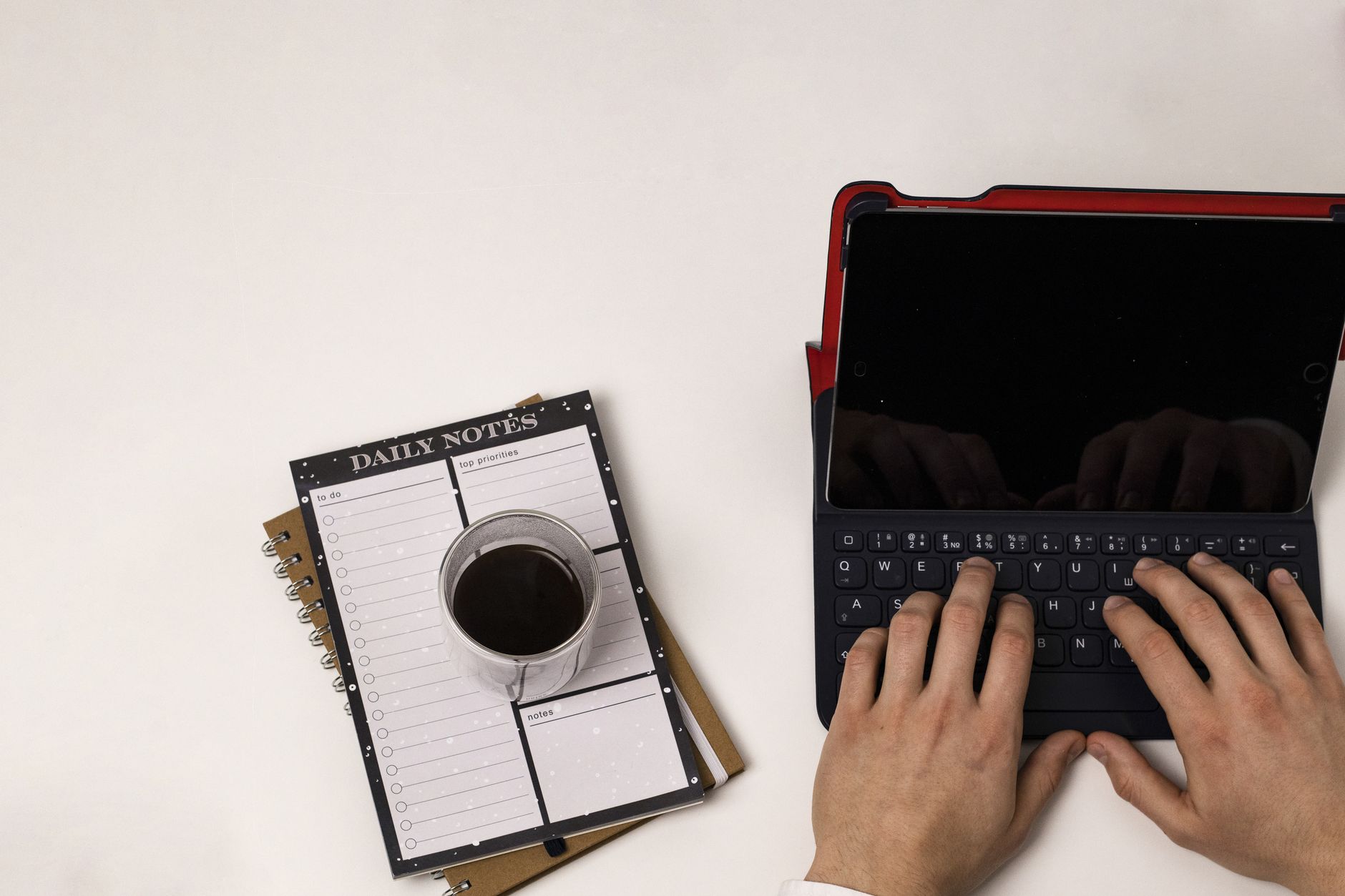 Person organizing notes and tasks in Notion on a tablet